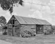 Photograph: [M. Simon House, (Northwest oblique, log barn)]