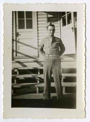 [A Soldier Standing in Front of a Building]