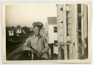 [Photograph of a Soldier on a Balcony]