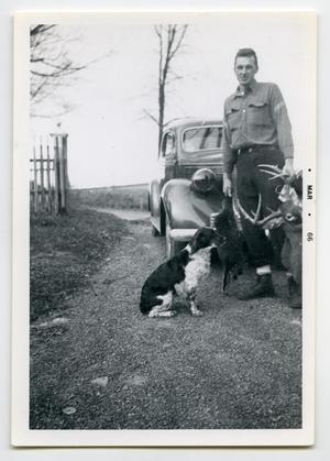 [A Soldier Standing with His Dog and Deer]