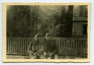 Primary view of object titled '[Photograph of Soldiers Sitting by Fence]'.