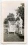 Photograph: [Photograph of a Soldier with a Garden Chair]