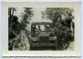 Thumbnail image of item number 1 in: '[Photograph of Soldiers Driving a Carrier]'.