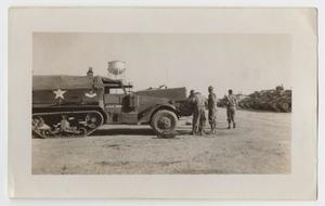 [Three Soldiers Standing in Front of a Half-Track]