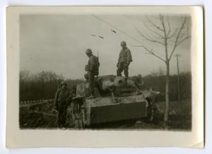 [Three Soldiers Examining a Tank]