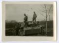 Photograph: [Three Soldiers Examining a Tank]