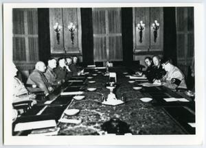 [Adolf Hitler Sitting at a Conference Table]