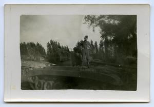 Primary view of [A Soldier Standing on a Tank]