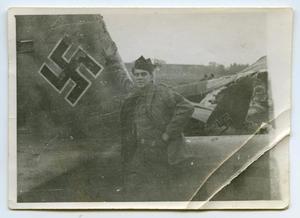 [A Soldier Standing Next to a German Airplane]