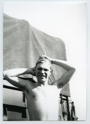 Primary view of object titled '[Photograph of Al Pheterson Taking Shower]'.