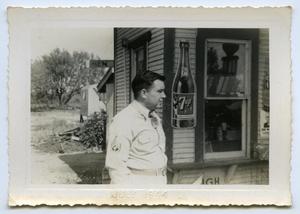 [A Soldier Stands in Front of a Store]