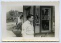 Primary view of [A Soldier Stands in Front of a Store]