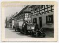 Photograph: [Three Vehicles Parked on a Sidewalk in Flanders]