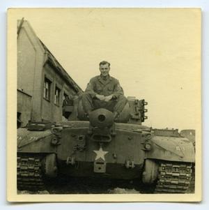 [A Soldier Riding on a Tank]