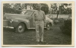 [Photograph of a Soldier by an Automobile]
