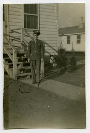 [A Soldier Standing in Front of Stairs]