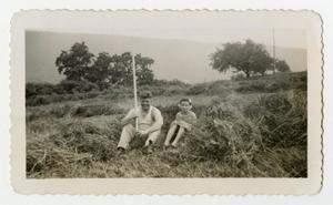 [Photograph of a Soldier and a Young Girl in a Hay Field]