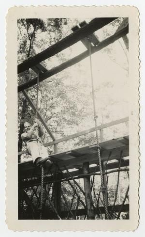 [Photograph of a Soldier Climbing a Rope]