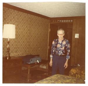Primary view of object titled '[Photograph of Louis Britton in Hotel Room]'.