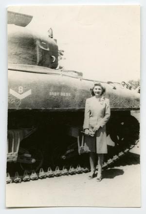 [A Woman Standing in Front of a Tank]