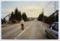 Primary view of [Photograph of a Man Standing on a Road]