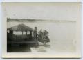 Photograph: [A Group of Soldiers Gas Up Their boat]