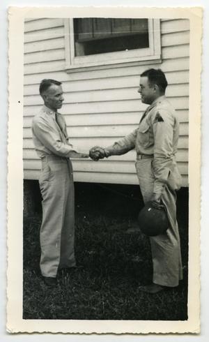 [Photograph of a Lieutenant and a Senior Officer]