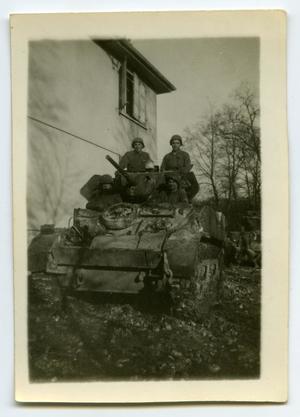 [Four Soldiers Sitting in a Tank]
