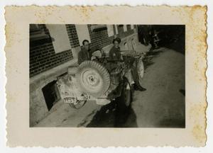 Primary view of object titled '[Two Men in Jeep in Alley]'.