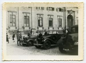 [Six German Soldiers Standing by Their Vehicles]