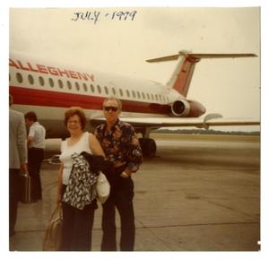 [Photograph of the Brittons in Front of Airplane]