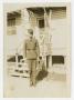 Photograph: [Soldier at Attention in Front of Building]