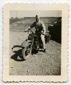 [Photograph of a Soldier on a Motorcycle]