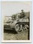 Photograph: [A Soldier Sitting on a Tank]