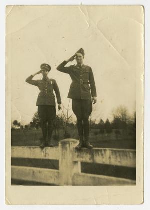 [Two Men Saluting on Fence]