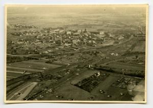 [Aerial Photograph of Battle-Damaged Town and Fields]