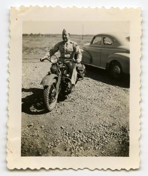 Primary view of object titled '[Photograph of a Soldier on a Motorcycle]'.