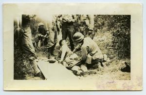[A Soldier Receiving First Aid to the Rear]