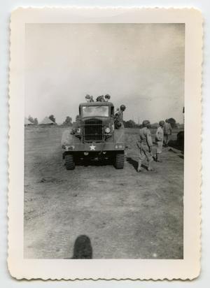 [Photograph of Soldiers around an Army Vehicle]