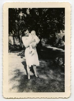 [Photograph of Woman Holding an Infant]