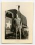 Photograph: [Photograph of Soldier by Army Truck]