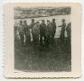 Photograph: [A Group of Soldiers Standing Next to a Ship's Railing]
