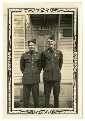 [Two Men in Front of Building T-427]