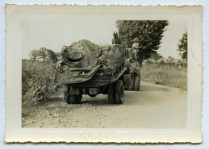 Primary view of object titled '[Photograph of Tractors on the Road (2)]'.