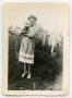 Photograph: [Photograph of a Lady holding a Puppy]