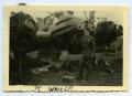 Photograph: [Photograph of Soldier and Damaged Airplane]