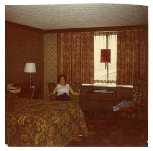 Primary view of object titled '[Photograph of Mrs. Britton in Hotel Room]'.