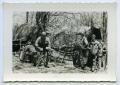 Photograph: [Soldiers Eating and Drinking in Camp]
