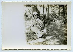 [A Soldier Rests Next to a Tree]