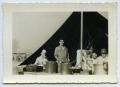 Photograph: [Photograph of Mealtime at a WW2 Camp]